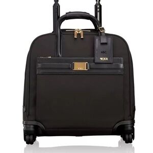 TUMI Black and Gold Rolling Travel Bag
